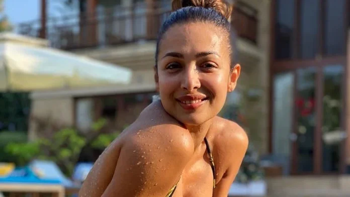 Malaika Arora seen in a backless outfit, trolled for bo*ldness