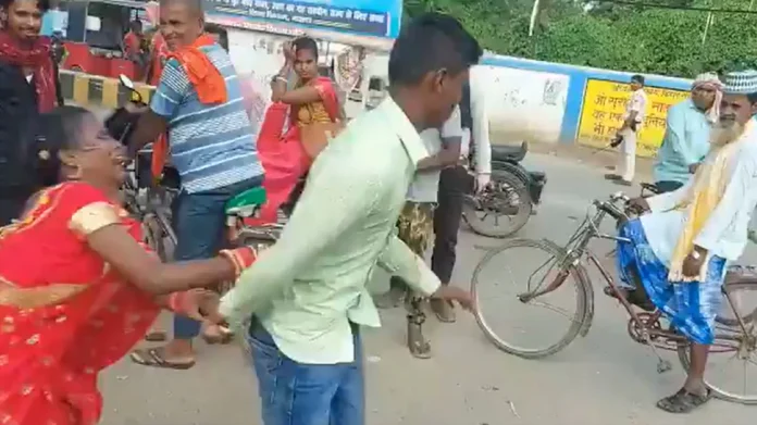 Holding the boy on the middle of the road, the girl started shouting, while walking said to the people - get me married!