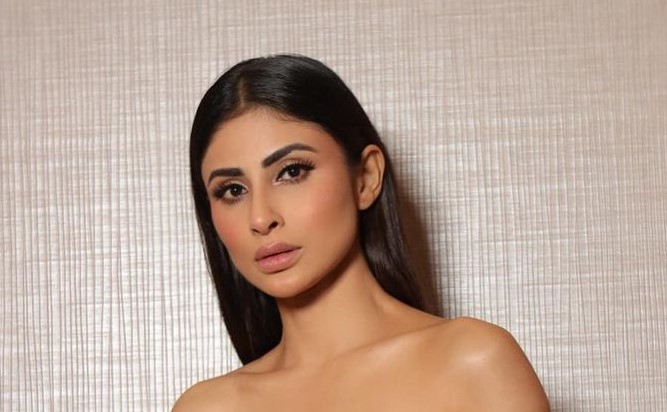 Mouni Roy did a bo*ld photoshoot wearing a deepneck mini dress, showed the hottest look ever while sitting on the bed