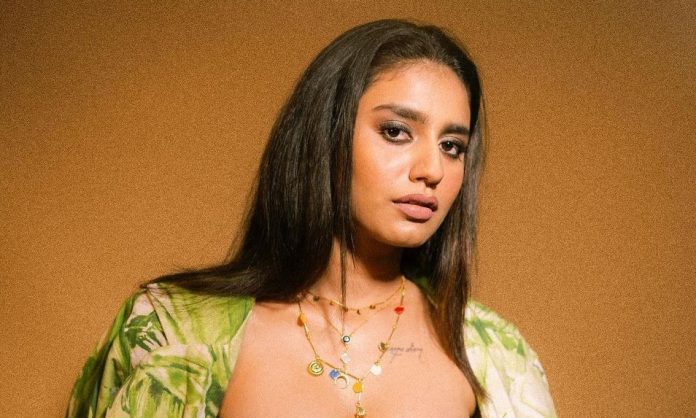 Priya Prakash Varrier shares photo in braless look in front open dress, fans are not tired of praising the internet sensation. Priya Prakash Varrier shares photo in braless look in front open dress, fans are not tired of praising the internet sensation.