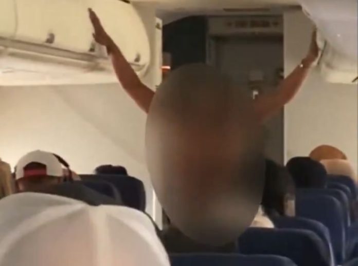 Woman seen doing dirty things without clothes in flight, video goes viral Woman seen doing dirty things without clothes in flight, video goes viral
