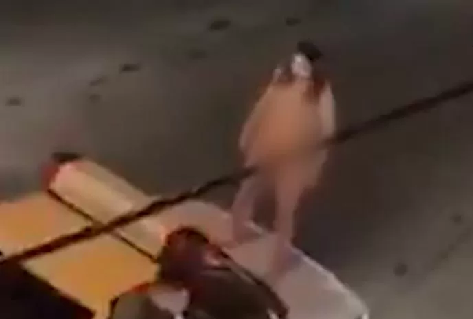 Muslim woman protesting against hijab ban takes off her clothes, climbs naked on police vehicle and creates ruckus
